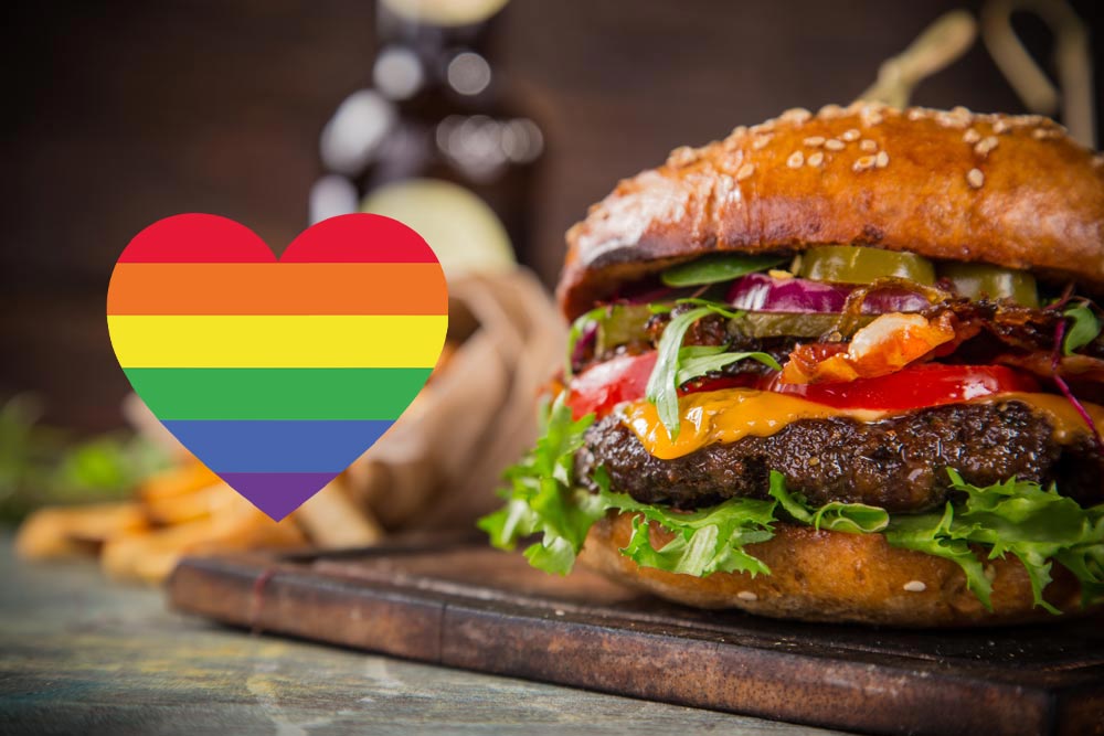 En hamburgare med en prideflagga i formen av ett hjärta